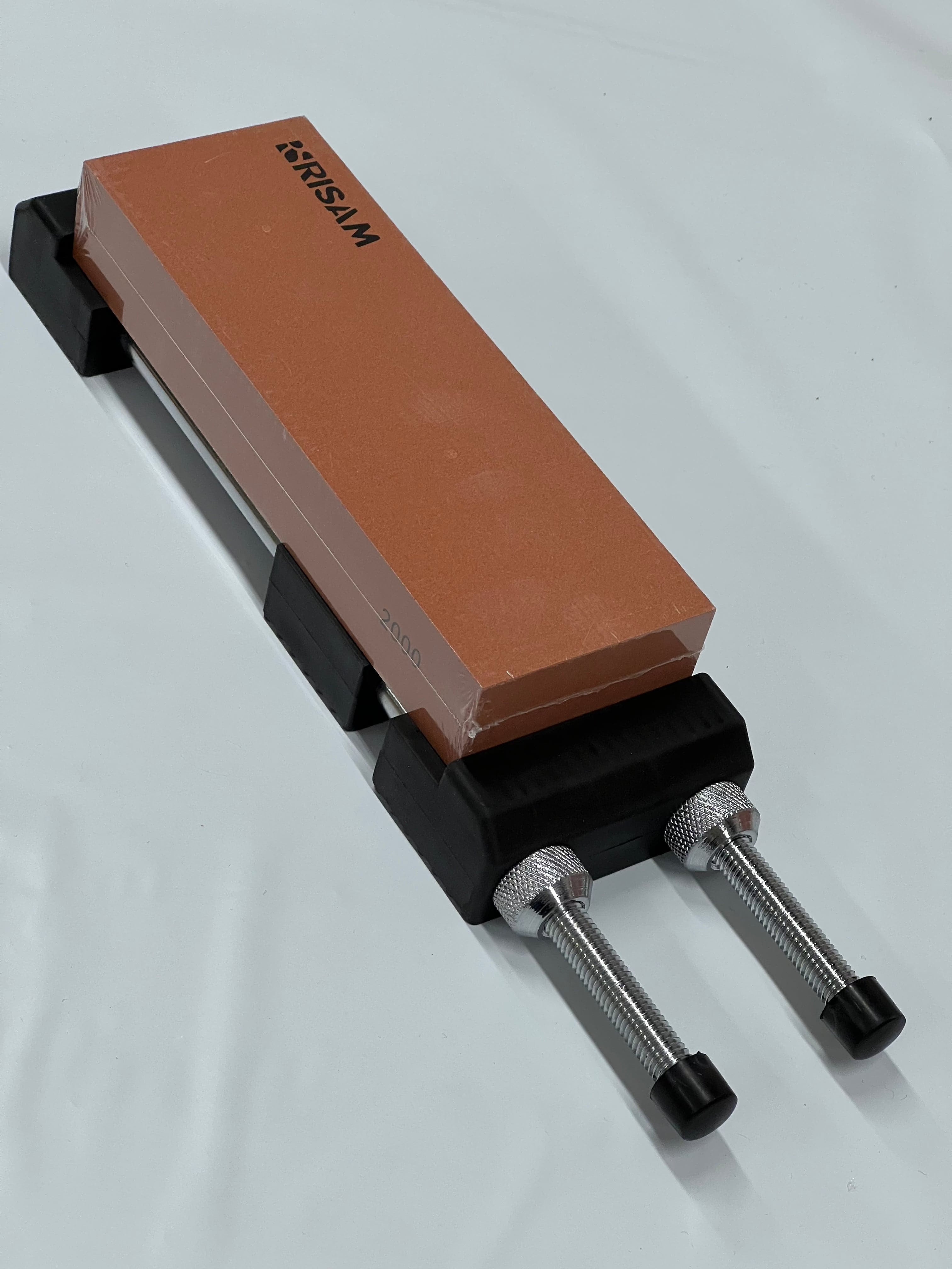 Hållare för slipsten